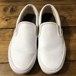Kids size 4.5 leather vans in white. In great condition. No holes or rips